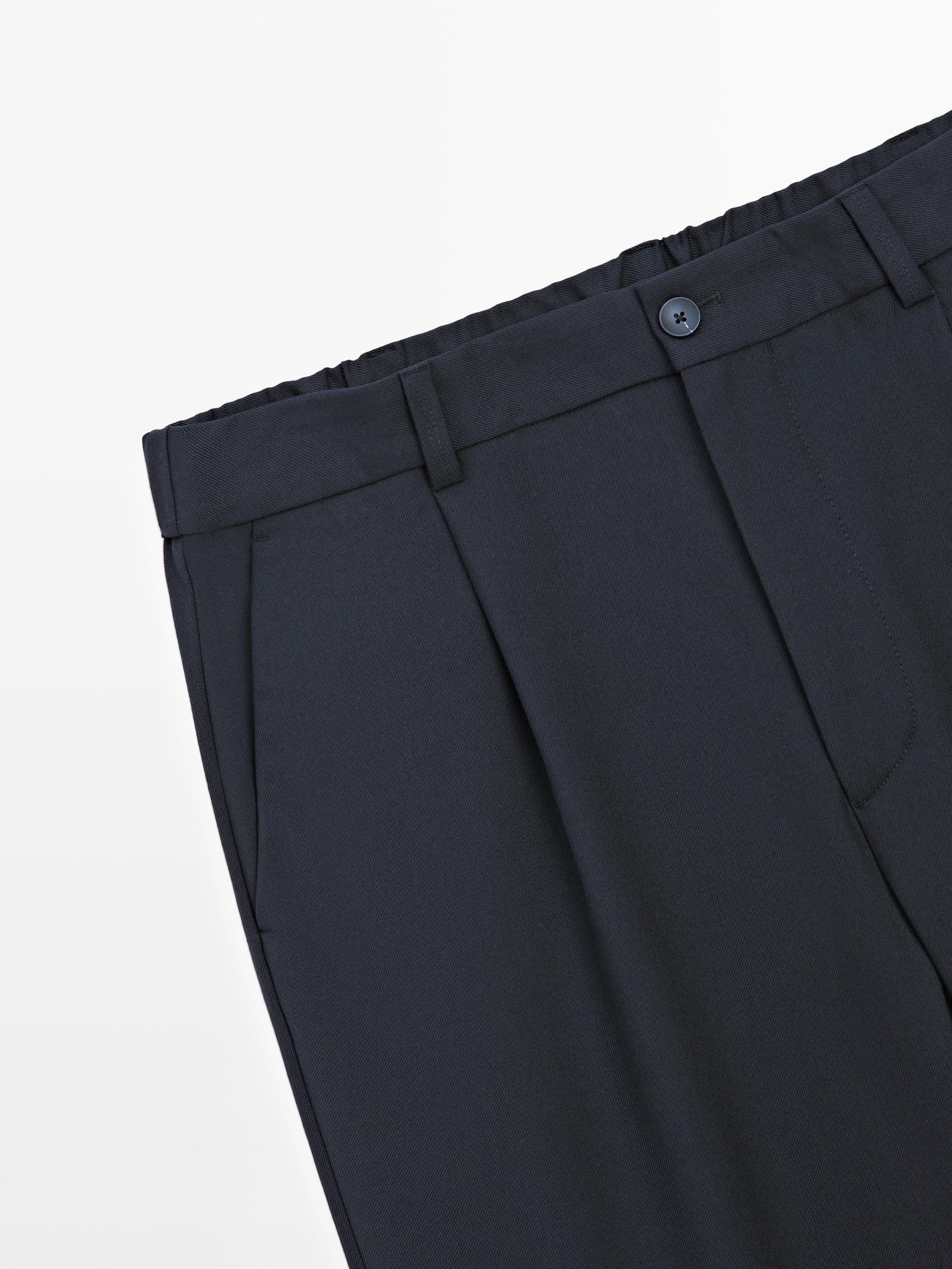 Pantalon relaxed fit à pinces en laine mélangée